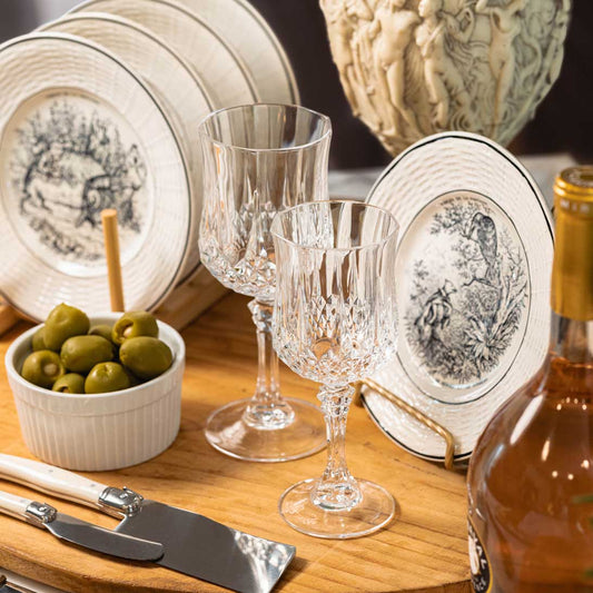 Vintage plates on a dinner table and on stand