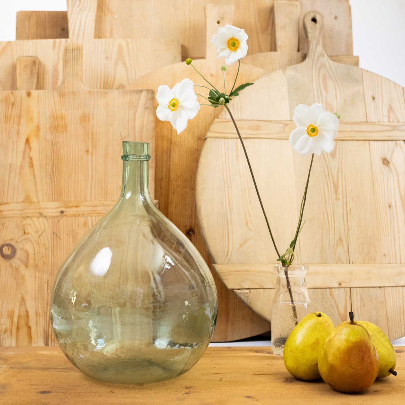 Rustic cutting boards with a clear bottle in the front