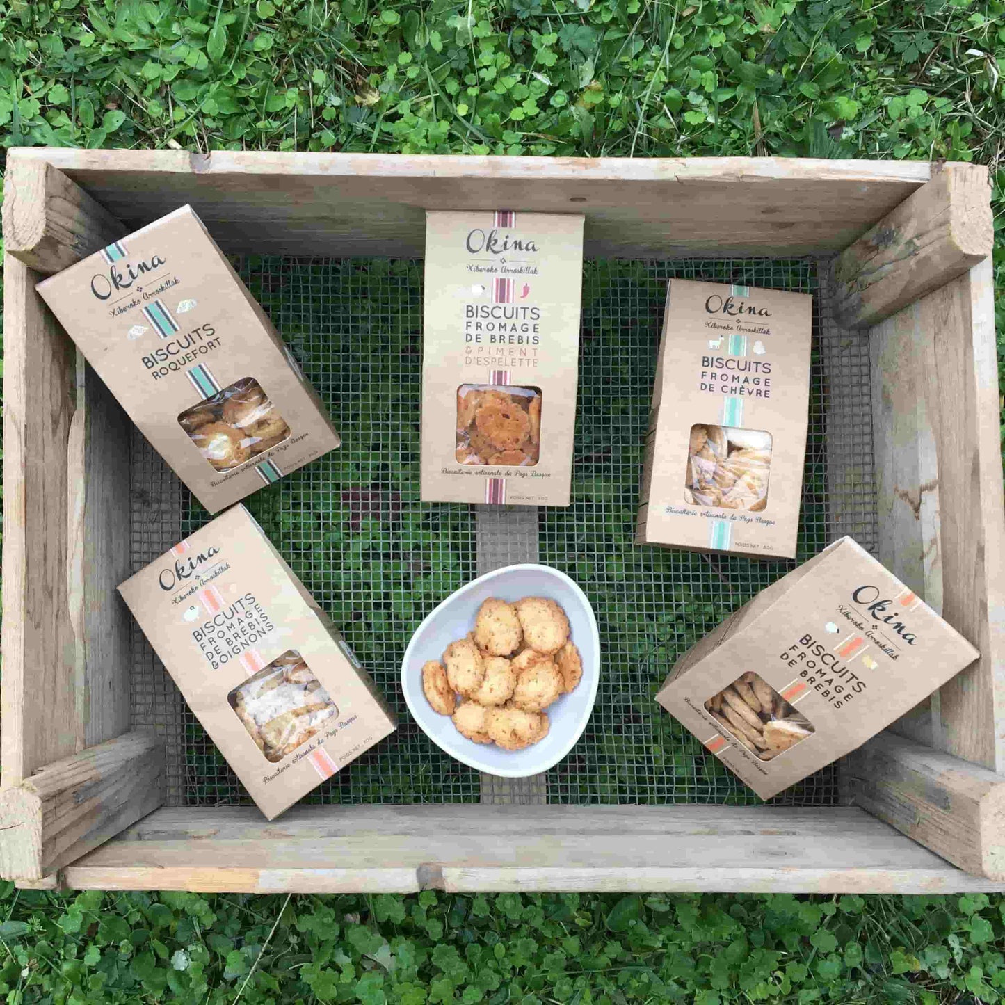 Box of Okina biscuits on a green background
