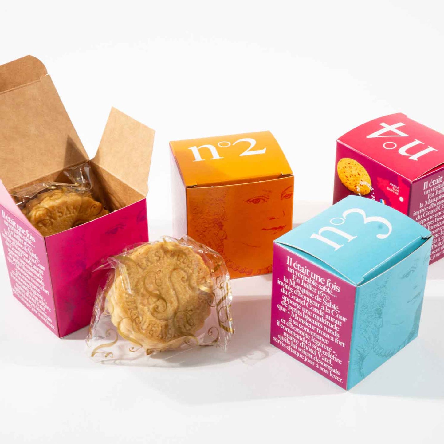 Colorful boxes with cookies on a white background