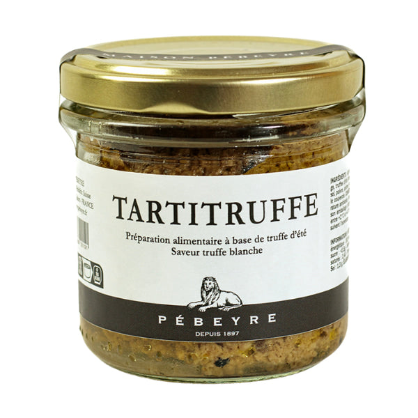 Jar of French truffle spread with gold lid on a white background