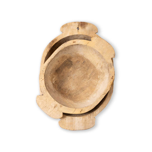 A pair of wooden handmade bowls on a white background
