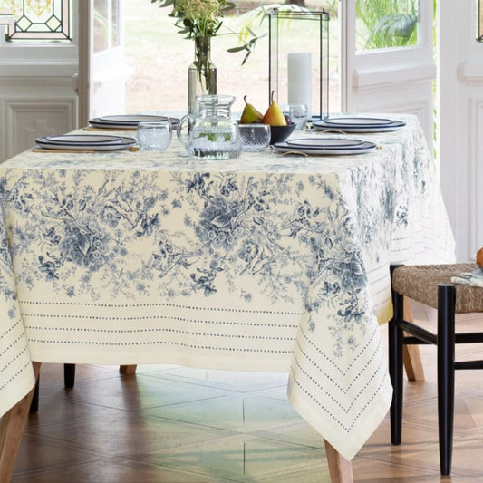 French Cotton Table Runner From France Dining table set with a floral tablecloth in a bright room
