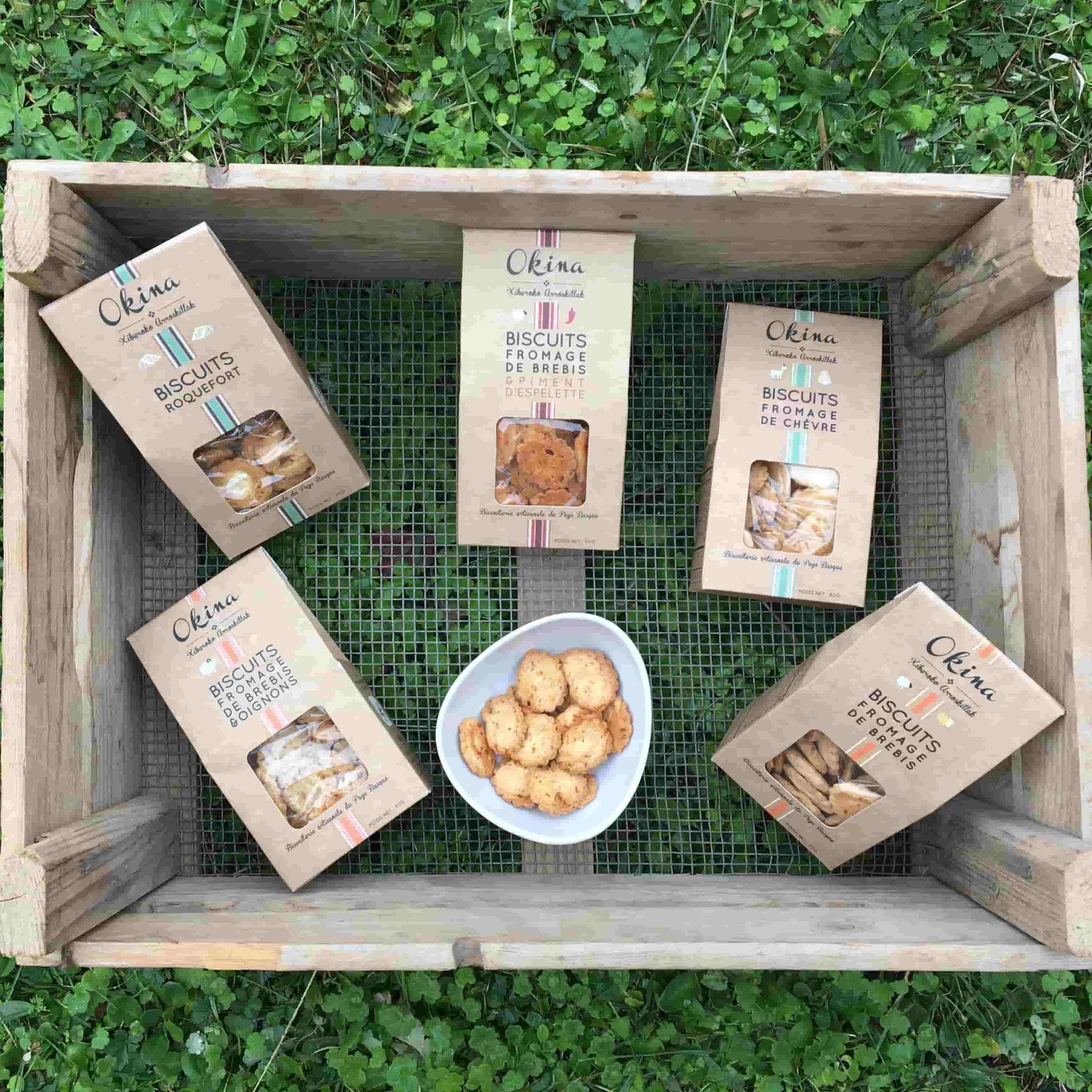 Box of Okina biscuits on a green background