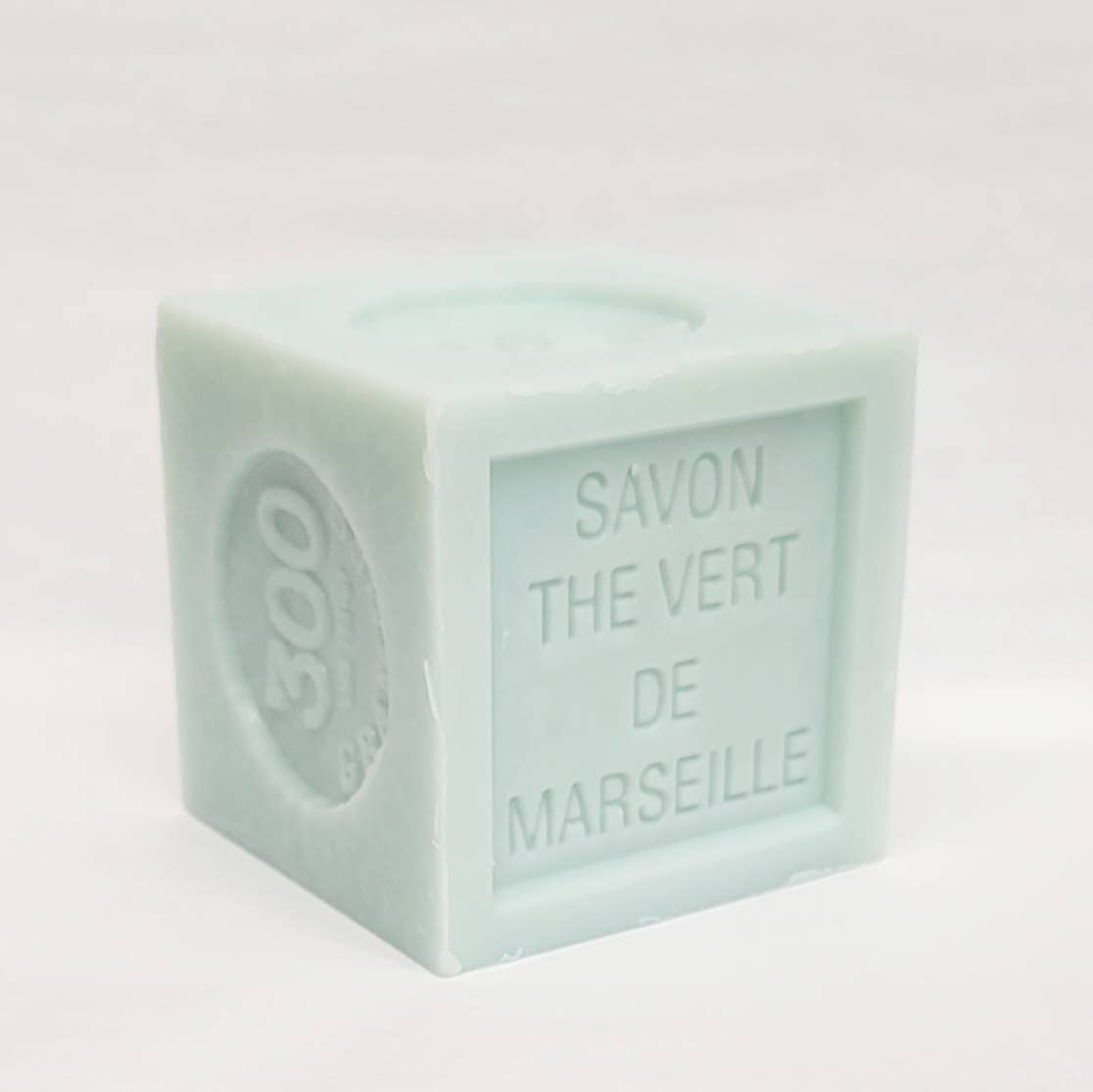  Cube-shaped Marseille soap with 'SAVON THE VERT DE MARSEILLE' text on a white background