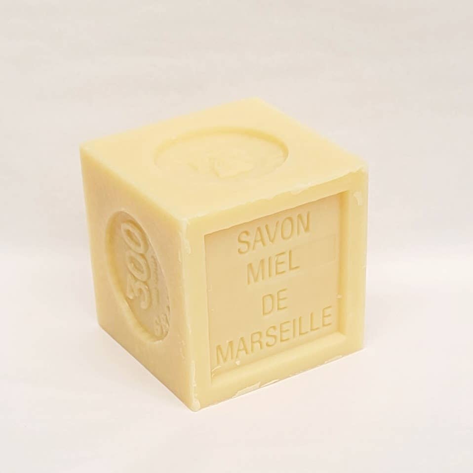  Cube-shaped Marseille soap with 'SAVON MIEL DE MARSEILLE' text on a white background