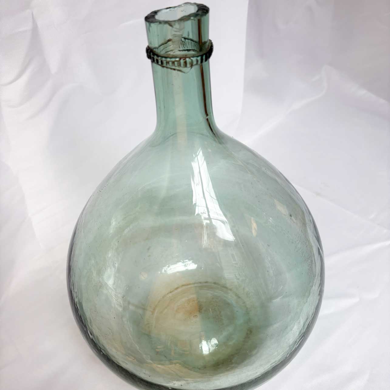 Clear glass bottle on a white background