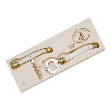 Corkscrew and bottle opener set with gold accents in a wooden box on a white background